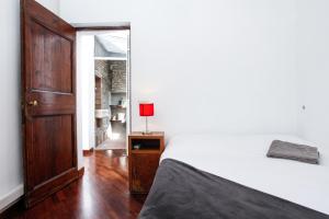 Tempat tidur dalam kamar di Pantheon Square Family Apartment
