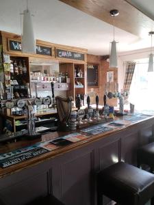 a bar in a pub with a counter top at The Chase Inn in Bishops Frome +21 photos