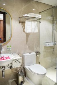 a bathroom with a toilet and a sink at Blubiz Hotel 9 in Hanoi +46 photos
