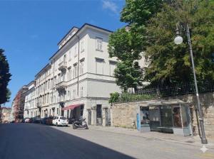 a white building on the side of a street at Larco Trieste studio living 3 in Trieste
