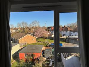 a view from a window of a house at Baoyan Kingston - Guest House with 2 bedrooms with 1 toilet-washing room in Kingston upon Thames