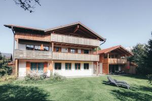 a house with a large yard in front of it at Luna Blanca - Apartment 2 in Schwangau