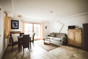 a living room with a couch and a table at Luna Mia 1 Chalet in Schwangau