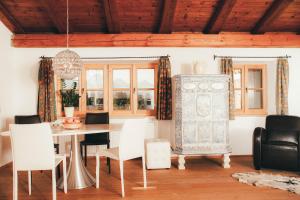 a dining room with a table and chairs at Luna Mia Apartment 4 in Schwangau
