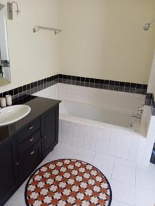 a bathroom with a tub and a sink at Origin life in Ban Na Sat +8 photos
