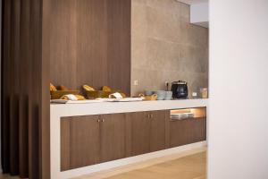 a kitchen with a counter top with some food on it at Niriides Hotel in Kolymbia