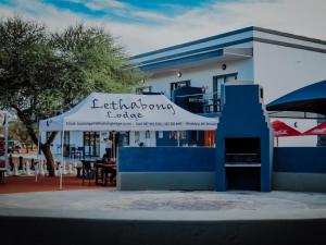 a building with awning in front of a restaurant at Lethabong Lodge in Thabazimbi
