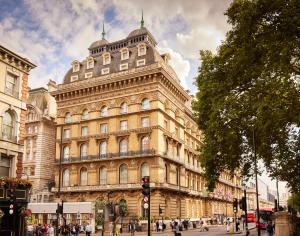 a large building on the corner of a street at The Clermont London, Victoria in London