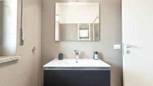 a bathroom with a sink and a mirror at Platinum House in Montesilvano +18 photos