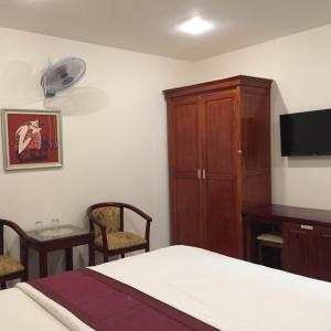 Postel nebo postele na pokoji v ubytování Huy Hoang 1 Hotel - Tân Bình