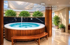 a jacuzzi tub in a mall with a bench at Don Giovanni Hotel Prague - Great Hotels of The World in Prague