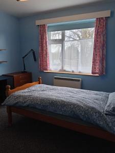 a bedroom with a bed and a window at Double Bed in Sawston