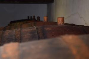 a close up of a wooden box with a wooden stick at Weingut Köfelgut - Turris Vini in Kastelbell-Tschars
