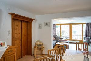 a kitchen and living room with a couch and a table at Ferienhaus Sissi in Schwangau