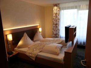 Postel nebo postele na pokoji v ubytování Wellness-Hotel Talblick