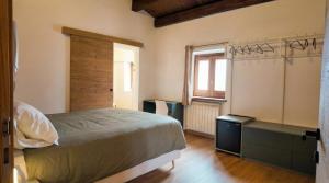 a bedroom with a bed and a window at Casa Ereva in Bagnoli Irpino +17 photos