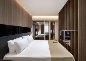a bedroom with a large white bed in a room at Nish Palace Beşiktaş in Istanbul