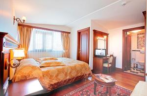 Postel nebo postele na pokoji v ubytování Hippodrome Hotel