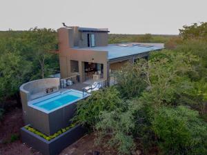 an aerial view of a house with a swimming pool at Akasha by Kruger Nights in Marloth Park
