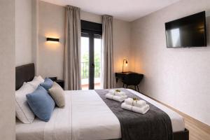 Llit o llits en una habitació de NerjaRooms