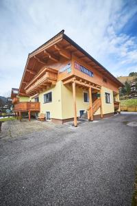 a large building with a wooden roof at Holiday Home Viehhofen in Viehhofen