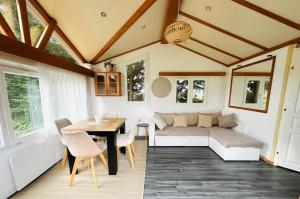 a living room with a couch and a table at Le clos de Launay in Souvigné