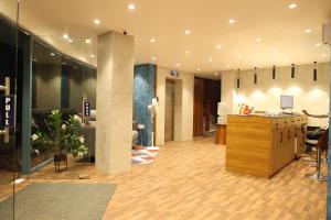 an office with a lobby with a reception desk and a lobby at SVS Grand in Dindigul