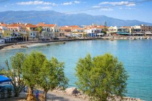 a large body of water with houses and trees at Matroni's House - Seafront Getaway in Monemvasia in Monemvasia