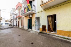 an empty street in a city with buildings at La Dimora del Centro - San Foca in San Foca