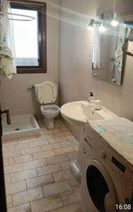 a bathroom with a sink and a toilet and a sink at Habitacion en piso compartido No alojamiento turistico in Benidorm
