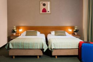 Кровать или кровати в номере Hotel Galicya