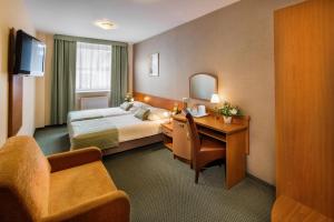 Postel nebo postele na pokoji v ubytování Hotel Galicya