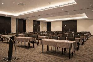 a large room with tables and chairs in it at DoubleTree by Hilton Nairobi in Nairobi +35 photos