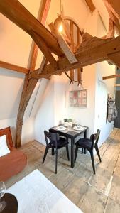 a dining room with a table and chairs in a room at RR4 - Penthouse in Antwerp