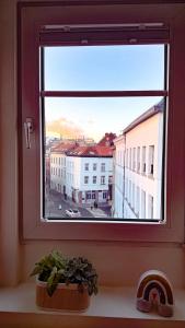 a window with a view of a city at RR4 - Penthouse in Antwerp