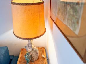 a lamp sitting on top of a table at Casa dell'Artista - HelloElba in Portoferraio