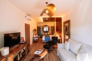 a living room with a couch and a bed at Herdade dos Moreiros in Arronches +37 photos