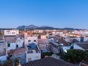 an aerial view of a city with roofs at Cas Ferrer Nou Hotelet in Alcudia