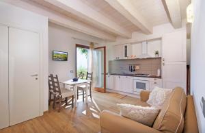 a living room with a couch and a table at La Terrazza del Conero La Ginestra in Sirolo