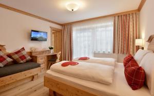Krevet ili kreveti u jedinici u okviru objekta Hotel Ritterhof Ellmau