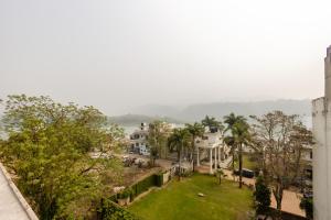a view of a city from the roof of a building at Hotel Ganga Ashoka-Stay By The Ganges At Triveni Ghat in Rishīkesh