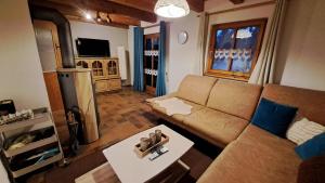 a living room with a couch and a table at Ferienhaus Alexandra in Regen