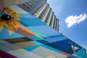 a building with a mural of a sunflower and a bird at The Bethesdan Hotel, Tapestry Collection by Hilton in Bethesda