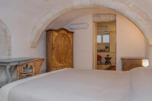 Posteľ alebo postele v izbe v ubytovaní Palazzo Degli Olivi