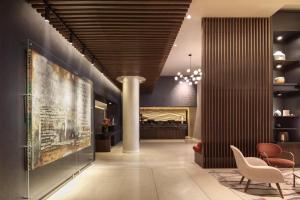 a lobby with a large painting on the wall at The Morrison Dublin, Curio Collection by Hilton in Dublin