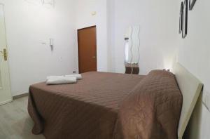 a bedroom with a large bed in a room at Pompei Centro Apartments in Pompei +21 photos