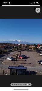 a view of a parking lot with cars parked at Blue lagon-350m plage-clim-parking in Saint-Cyprien-Plage