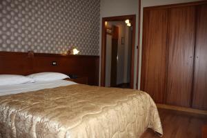 Postel nebo postele na pokoji v ubytování Hotel Ristorante Donato