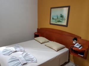 Säng eller sängar i ett rum på Hotel Bavarium