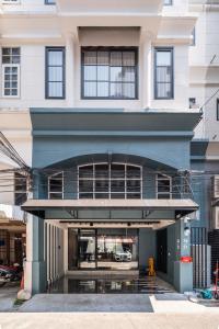 a large building with a large window at S21 Mellow Phromphong in Bangkok